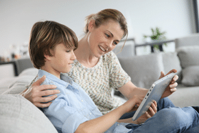 Mother and son using tablet